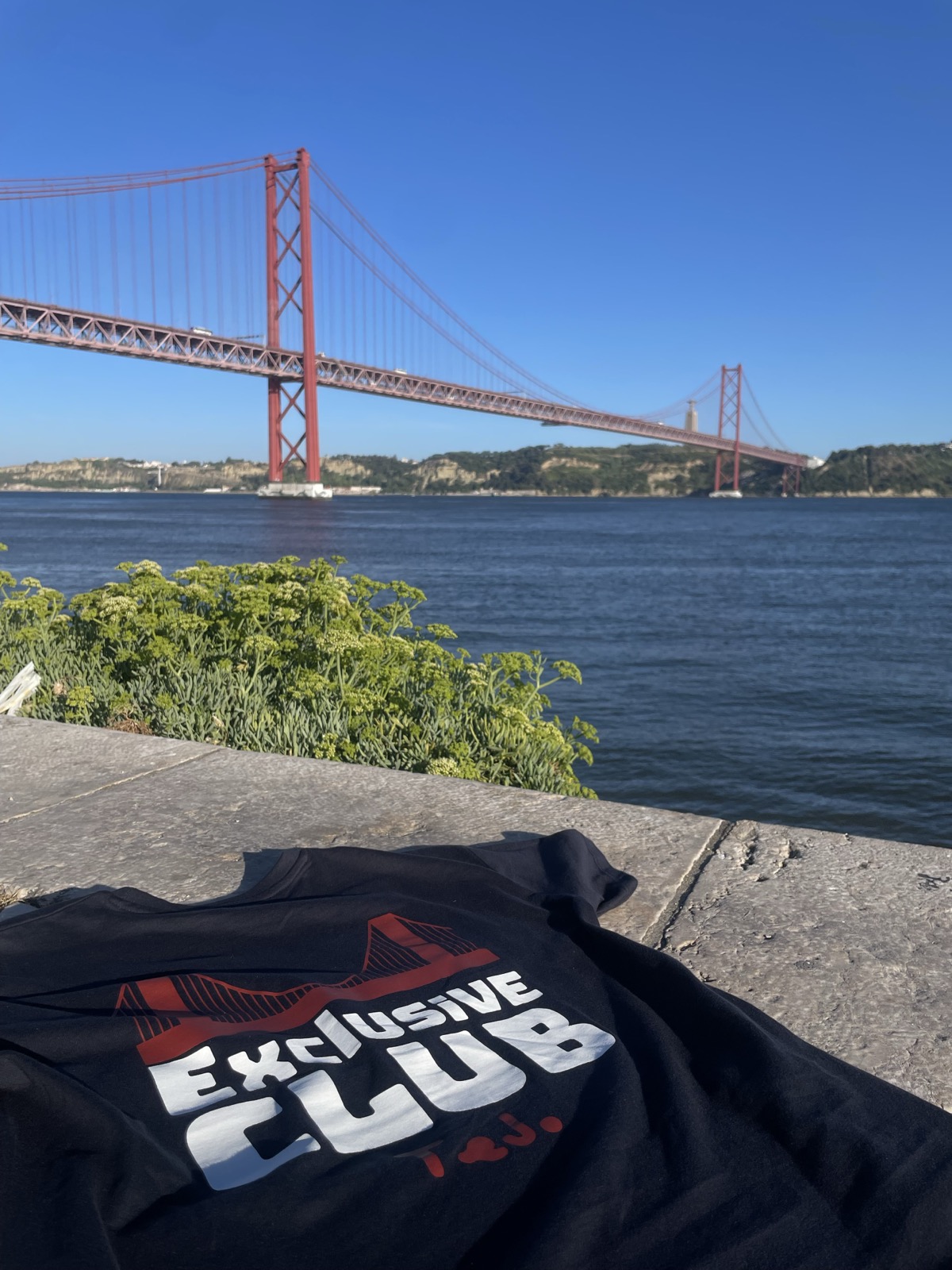 The Exclusive Club tee laid out on the quay in the sun.